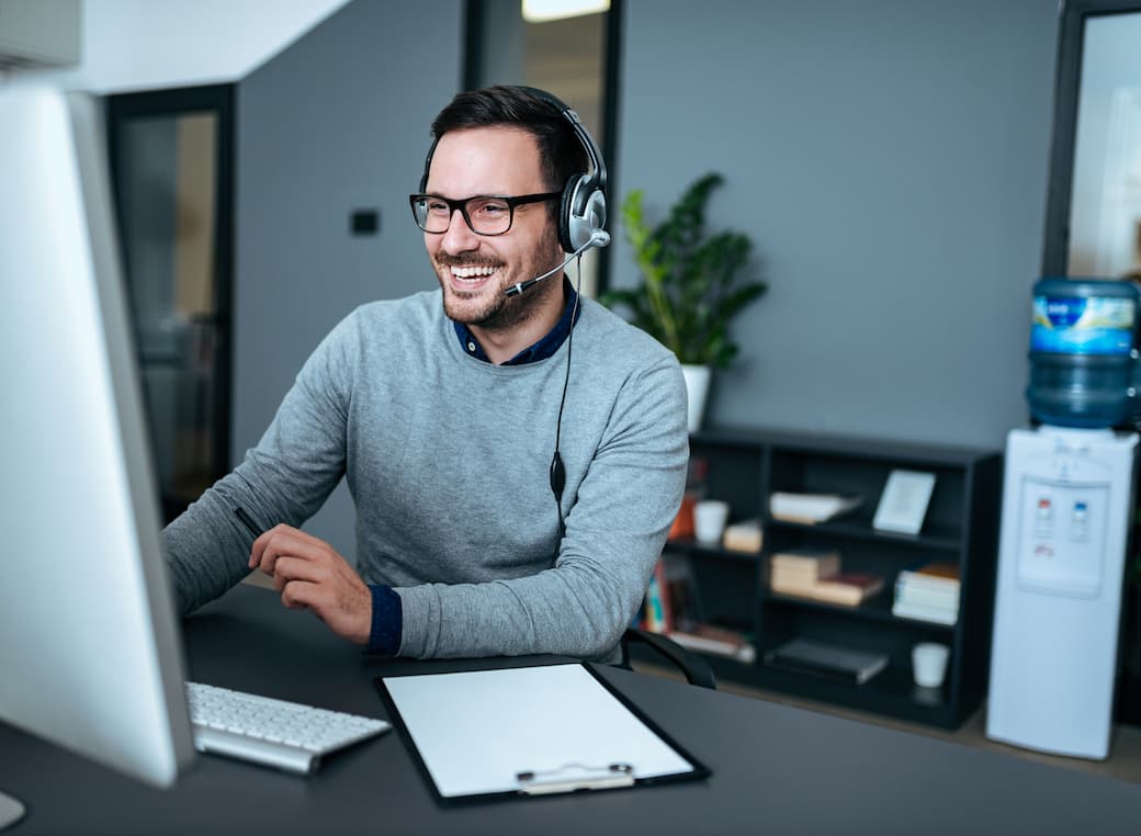 Man at computer providing it helpdesk support services