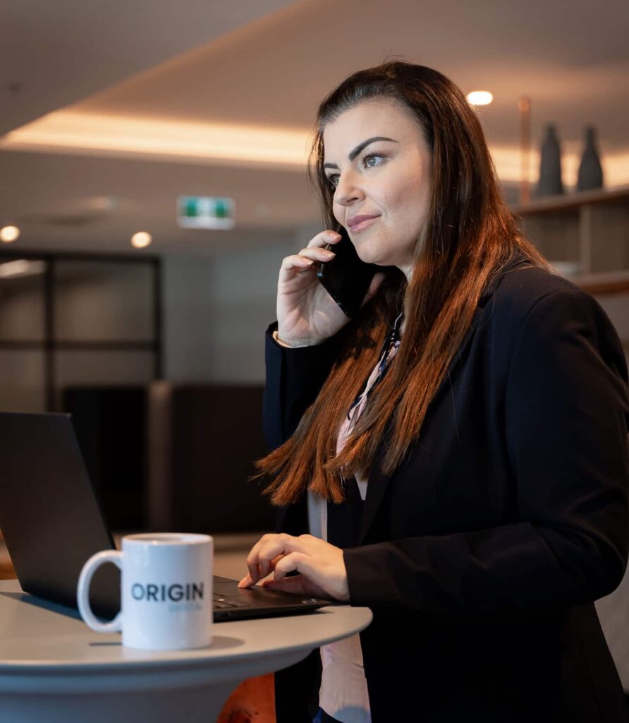 Origin Digital Consultants woman on phone